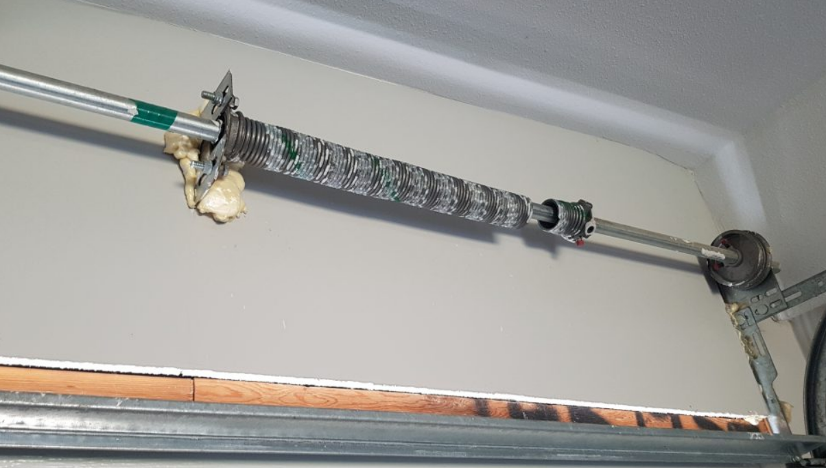 Technician performing garage door spring repair for a residential property in Dublin, ensuring smooth and safe operation of the garage door.