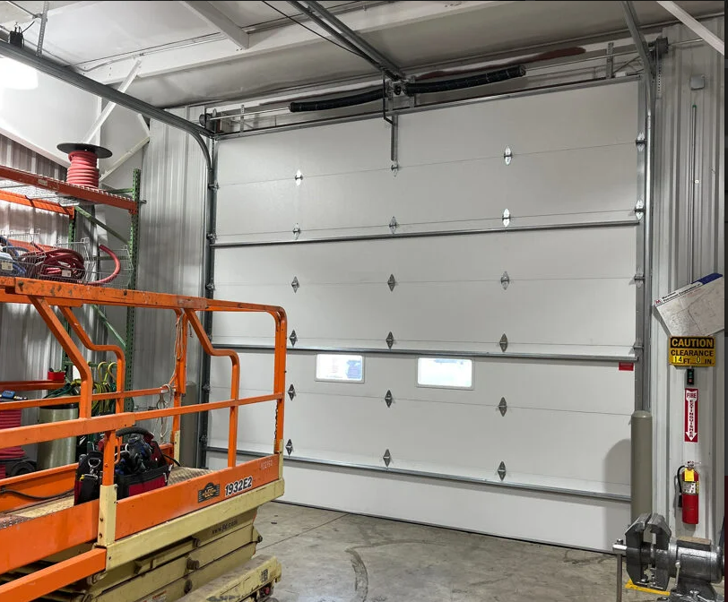 a technician from Dublin Garage Door Repair performing maintenance on a residential garage door, illustrating the expertise and quality service provided by the company.