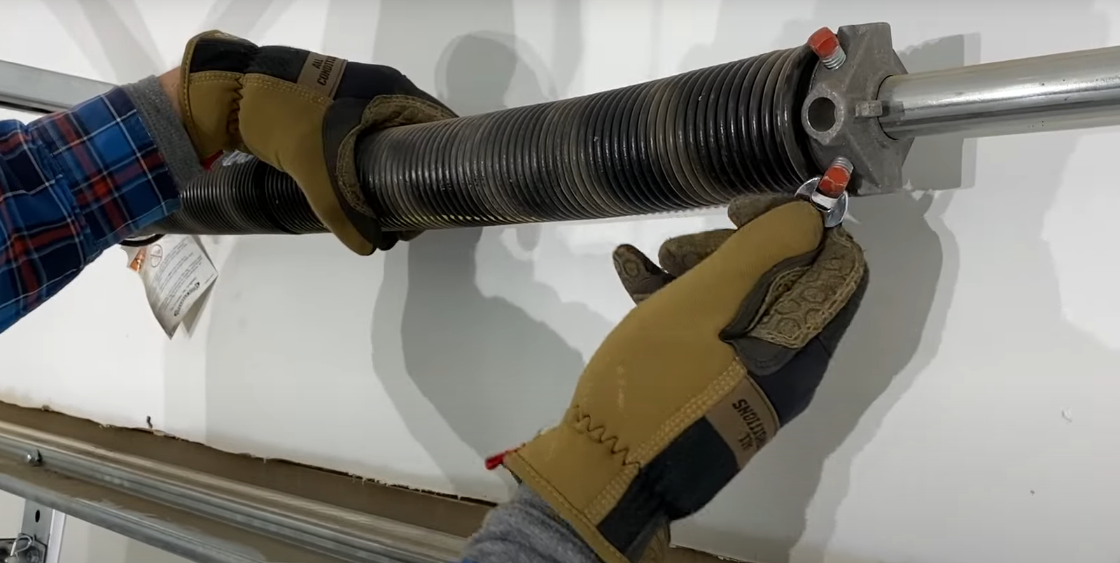 Professional technician performing garage door spring repair service for a residential garage in Dublin, ensuring safe and efficient operation.